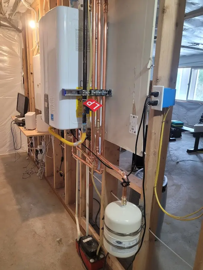 Licensed plumber repairing a kitchen sink in Brambleton